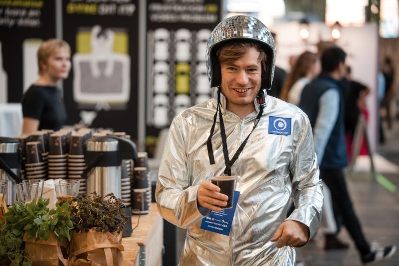 Karsten Madsen, founder of Morningscore, wearing his silver spacesuit and looking like an astronaut.